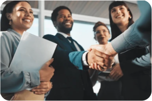 A diverse group of professionals shaking hands, symbolizing successful direct hire and employment partnerships.